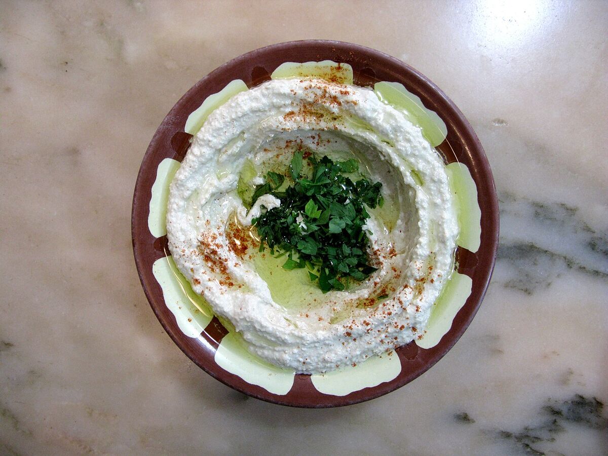 Lebanese hummus topped with olive oil, paprika and parsley, served in Baalbek, Lebanon.